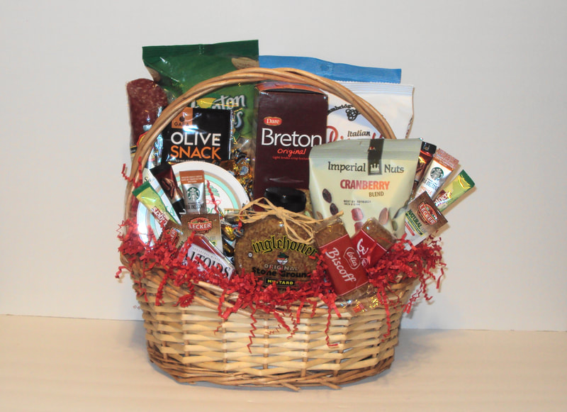 Speciality gift basket fill with cracker, cheese, sausage roll, spreads, nuts and more. 